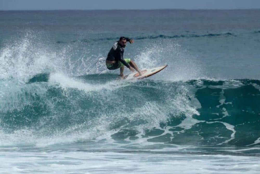 A surfer is riding a wave.